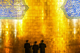 آیین تعویض پرچم گنبد حرم امام رضا(ع)