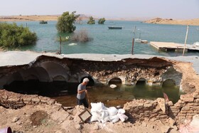 به زیر آب رفتن روستاهای "پرنوشته" و "تلخاب تاجدین" از توابع مسجدسلیمان بعد از آبگیری سد «گتوند»