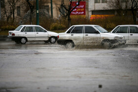بارش باران و آبگرفتگی معابر در همدان