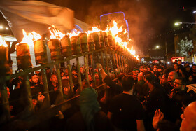 آیین مشعل گردانی نجفی‌های مقیم مشهد در شب تاسوعا‎